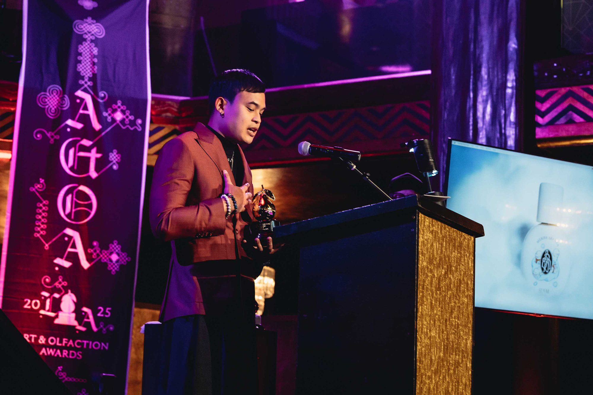 Nutt Wesshasartar with Mekha Aranya and the Golden Pear trophy at the 2025 Art and Olfaction Awards